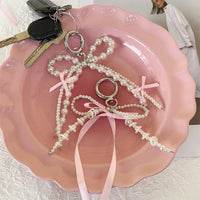 Perlen Schlüsselanhänger Schleife – Taschen-Charm mit Perlen & rosa Schleife Bild 1